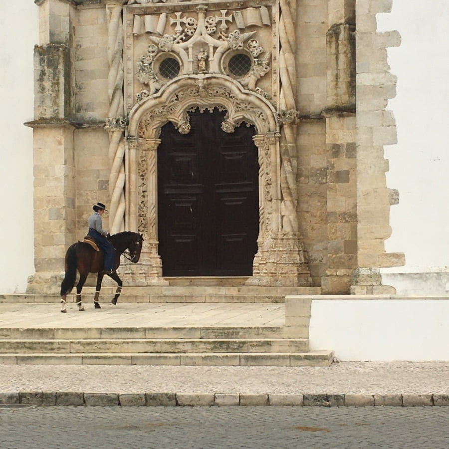 woman on horse on church steps